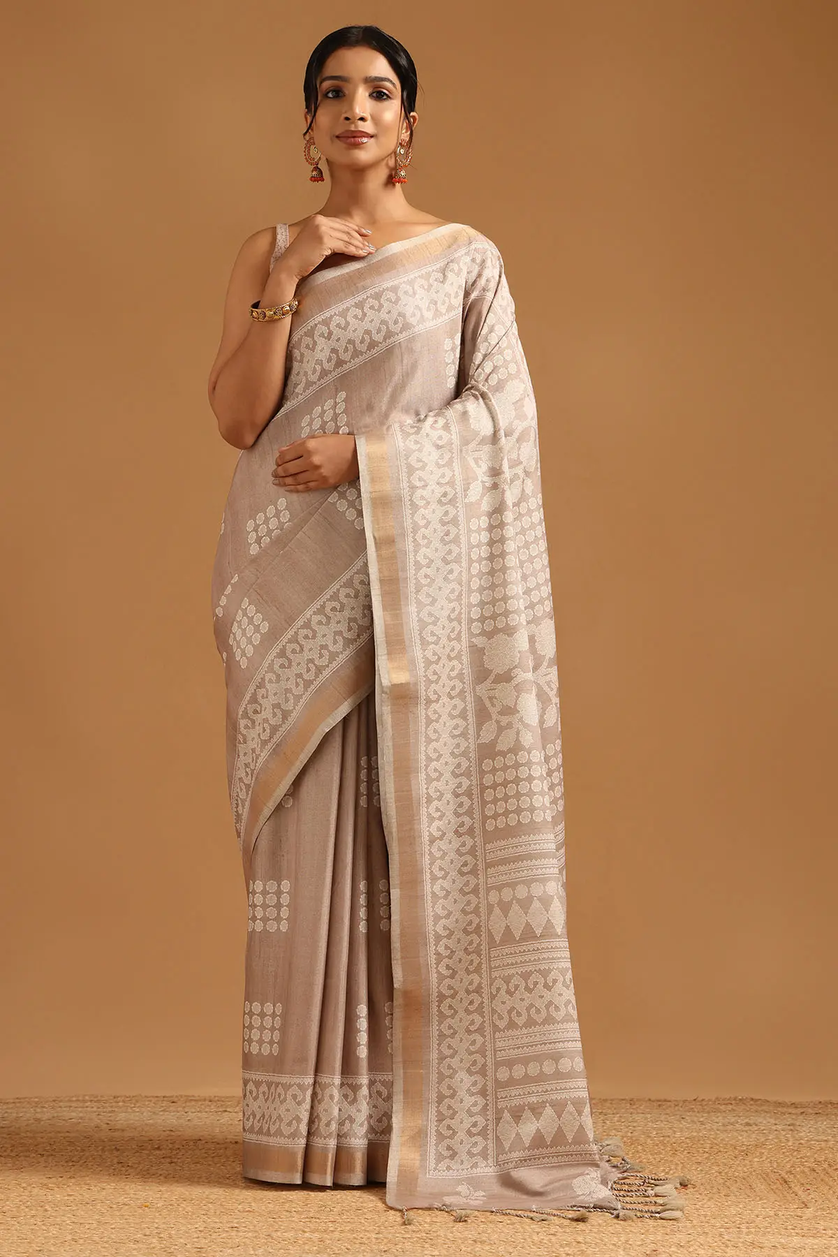 Beige Art Silk Ethnic Motifs Saree With Tassels